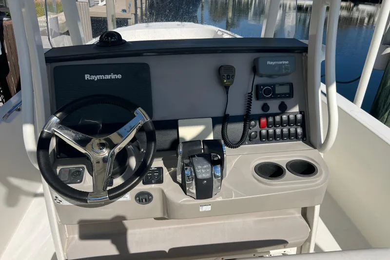 Slide: The Image of 2015 Boston Whaler 270 Dauntless helm with Raymarine electronics and dual cup holders. - 39