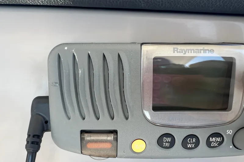 Slide: The Image of Raymarine marine radio on 2015 Boston Whaler 270 Dauntless boat dashboard. - 41