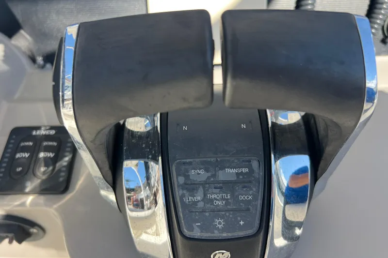 Slide: The Image of Close-up of throttle controls on a 2015 Boston Whaler 270 Dauntless boat. - 42