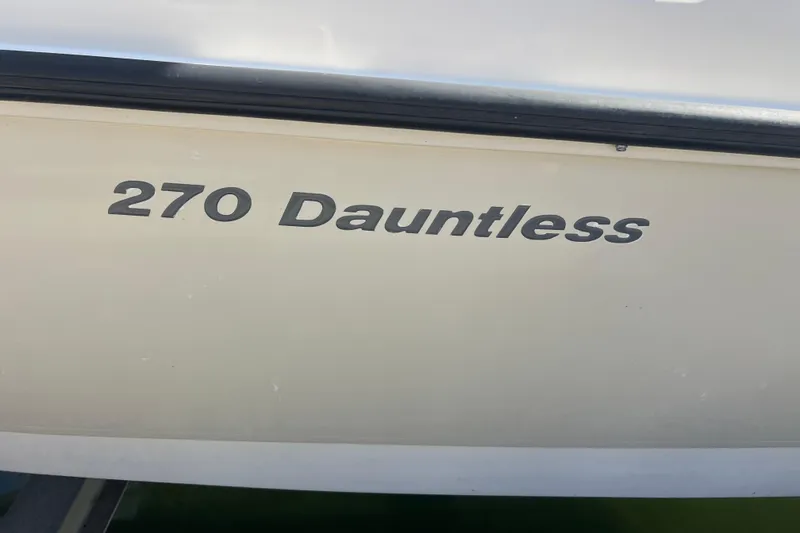 Slide: The Image of 2015 Boston Whaler 270 Dauntless boat nameplate on hull. - 5