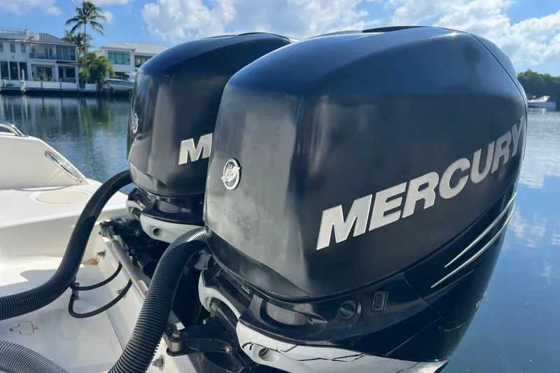 Slide: The Image of Twin Mercury outboard engines on a 2015 Boston Whaler 270 Dauntless boat. - 6