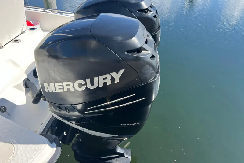 Slide: The Image of Twin Mercury outboard engines on a 2015 Boston Whaler 270 Dauntless boat. - 9