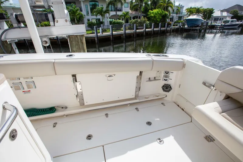 Slide: The Image of 2023 Boston Whaler 380 Outrage boat interior, featuring spacious seating and modern amenities. - 4