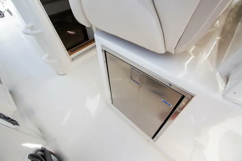 Slide: The Image of 2023 Boston Whaler 380 Outrage interior with stainless steel storage compartment. - 7