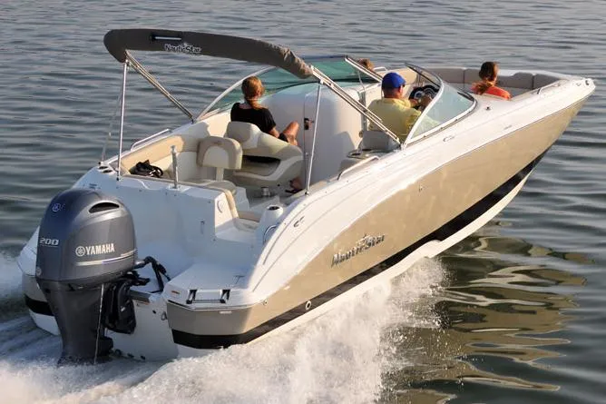 The Image of Manufacturer Provided Image: 2018 NauticStar 243DC Sport Deck boat cruising on water with Yamaha outboard motor. - 2