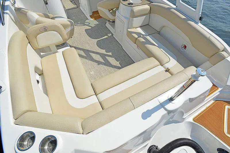 Slide: The Image of Manufacturer Provided Image: 2018 NauticStar 243DC Sport Deck boat interior with beige and white seating. - 4