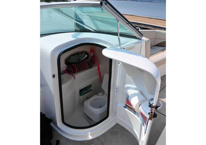 Slide: The Image of Manufacturer Provided Image: 2018 NauticStar 243DC Sport Deck boat with onboard toilet compartment. - 5