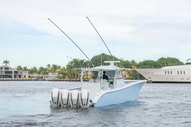 Slide: The Image of 2023 Yellowfin 42 Offshore boat cruising on a scenic waterway. - 25