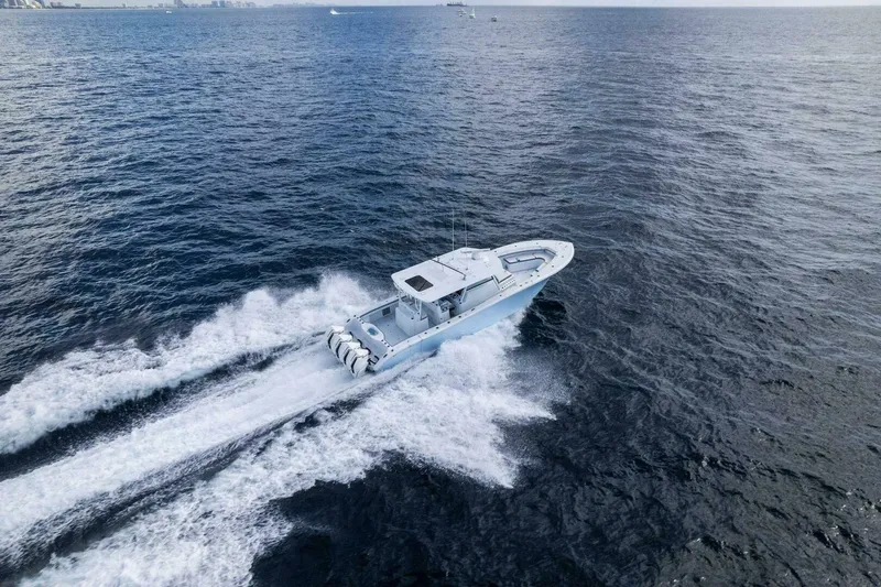 Slide: The Image of 2023 Yellowfin 42 Offshore boat cruising on open ocean waters. - 26