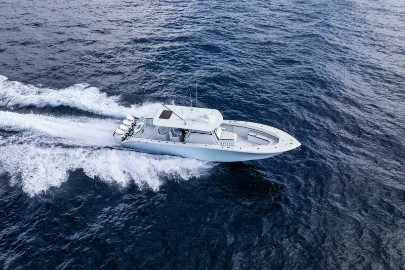 Slide: The Image of 2023 Yellowfin 42 Offshore boat cruising on open ocean waters. - 27