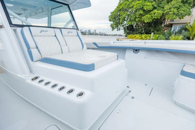 Slide: The Image of 2023 Yellowfin 42 Offshore boat interior with cushioned seating and sleek design. - 36