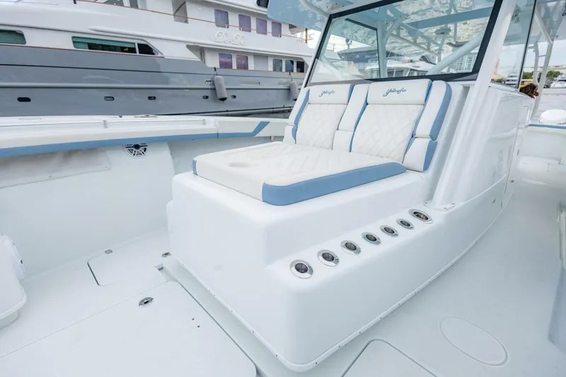 Slide: The Image of 2023 Yellowfin 42 Offshore boat interior with cushioned seating and sleek design. - 37