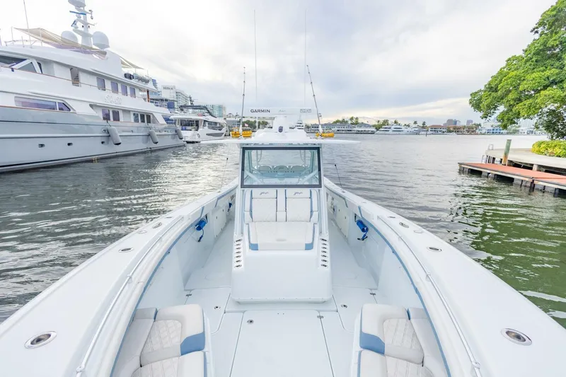 Slide: The Image of 2023 Yellowfin 42 Offshore boat docked, showcasing spacious deck and luxurious seating. - 39