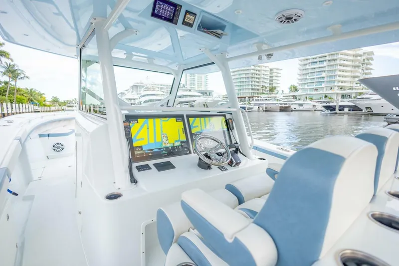 Slide: The Image of 2023 Yellowfin 42 Offshore boat interior with advanced navigation system and luxurious seating. - 41