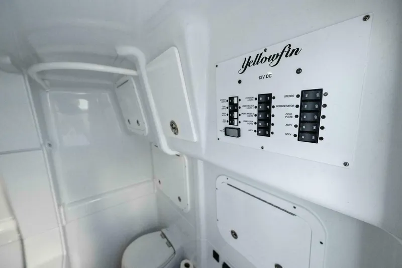 Slide: The Image of Interior of 2023 Yellowfin 42 Offshore boat with control panel and toilet. - 47