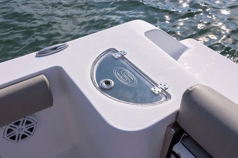 Slide: The Image of 2022 Sportsman Open 212 Center Console boat detail with water backdrop. - 12