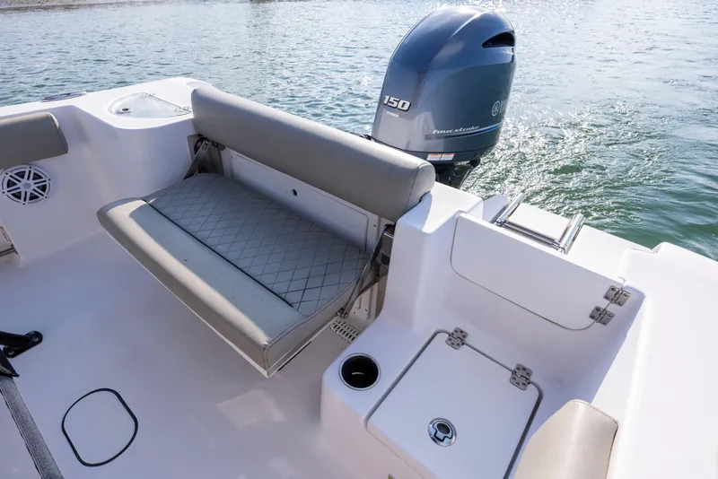 Slide: The Image of 2022 Sportsman Open 212 Center Console boat with Yamaha 150 engine, rear seating, and storage. - 14
