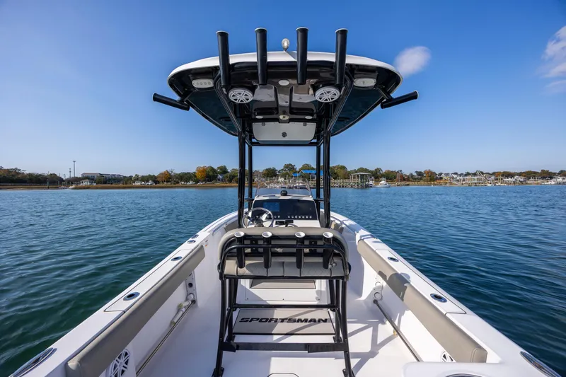 Slide: The Image of 2022 Sportsman Open 212 Center Console boat on calm water, clear sky background. - 15