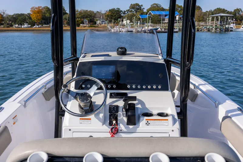 Slide: The Image of 2022 Sportsman Open 212 Center Console boat dashboard on calm water. - 16