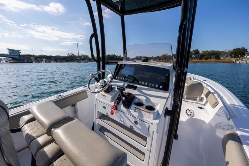 Slide: The Image of 2022 Sportsman Open 212 Center Console boat on water, featuring modern helm and seating. - 17