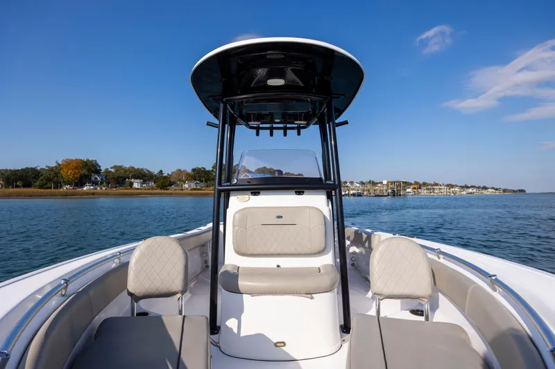 Slide: The Image of 2022 Sportsman Open 212 Center Console boat on calm water, clear sky background. - 25