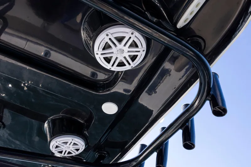 Slide: The Image of 2022 Sportsman Open 212 Center Console boat speakers and rod holders, viewed from below. - 26