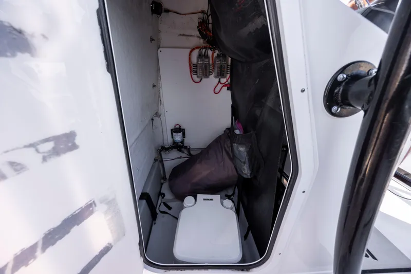Slide: The Image of Interior of a 2022 Sportsman Open 212 Center Console boat storage compartment. - 27