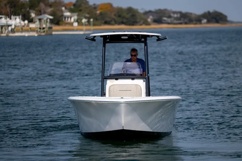Slide: The Image of 2022 Sportsman Open 212 Center Console boat on calm water. - 4