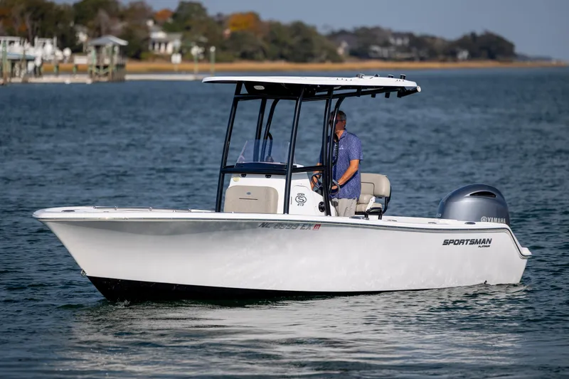 Slide: The Image of 2022 Sportsman Open 212 Center Console boat cruising on calm water. - 5