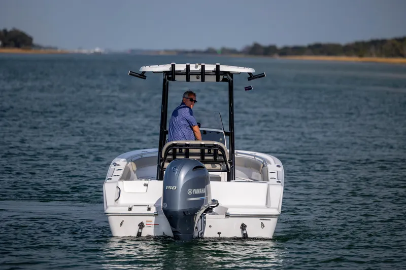 Slide: The Image of 2022 Sportsman Open 212 Center Console boat on water, rear view with Yamaha engine. - 8