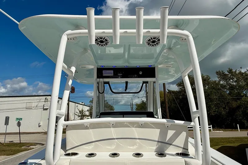 Slide: The Image of 2026 Sea Hunt Ultra 285 Coffin Box boat with T-top and rod holders. - 11