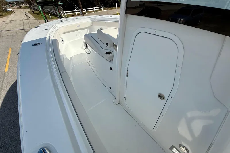 Slide: The Image of 2026 Sea Hunt Ultra 285 Coffin Box boat interior with seating and storage. - 12