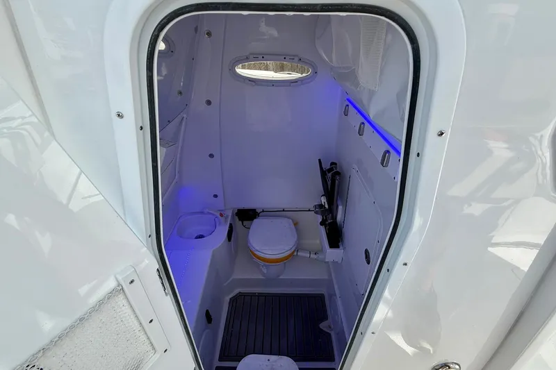 Slide: The Image of Interior of 2026 Sea Hunt Ultra 285 Coffin Box boat bathroom with modern amenities. - 13