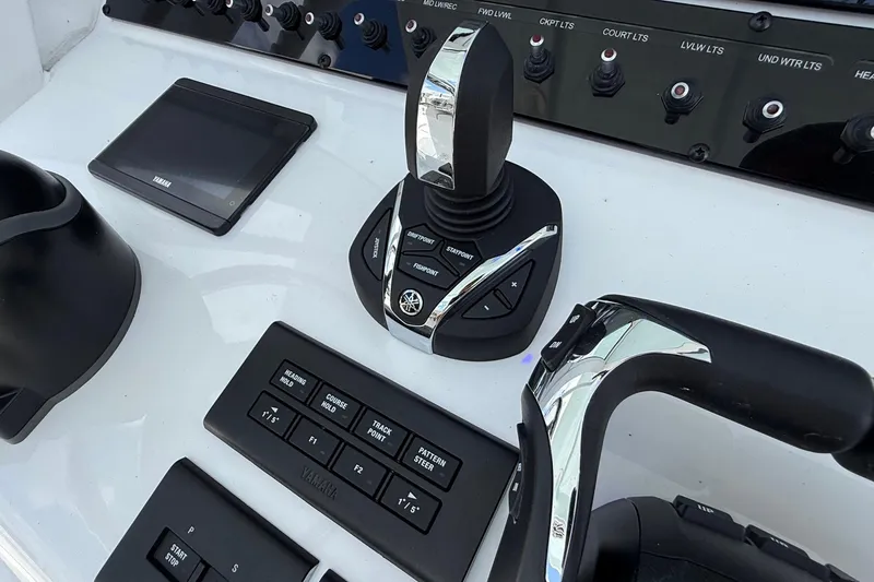 Slide: The Image of Control panel of 2026 Sea Hunt Ultra 285 Coffin Box with Yamaha joystick and switches. - 18