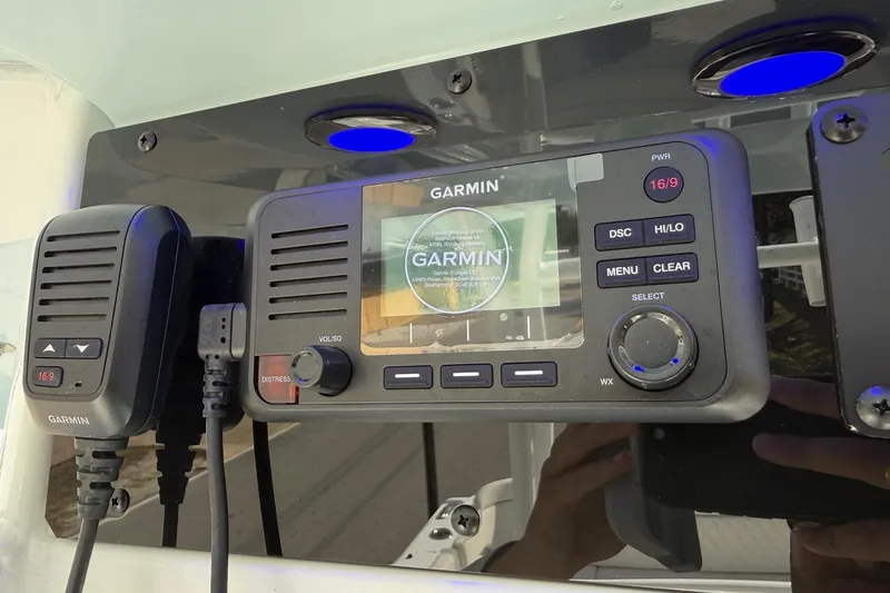 Slide: The Image of Garmin marine radio on 2026 Sea Hunt Ultra 285 Coffin Box boat dashboard. - 19