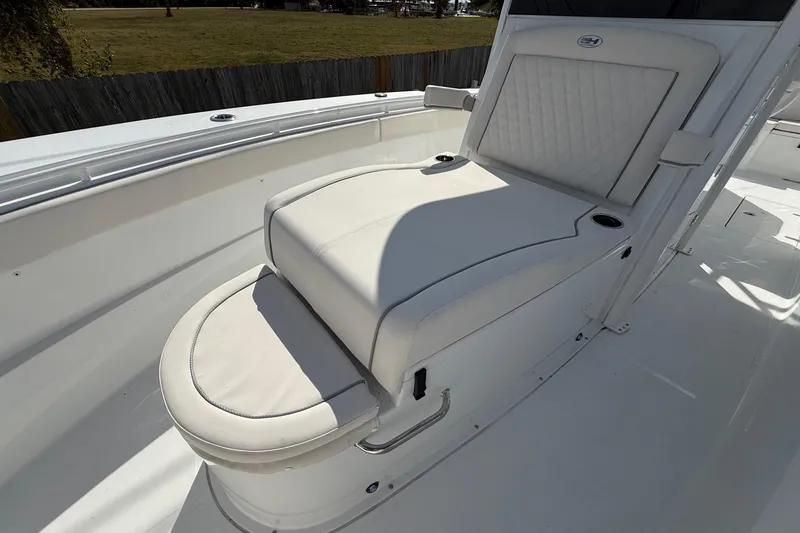 Slide: The Image of 2026 Sea Hunt Ultra 285 Coffin Box boat with cushioned seating. - 22