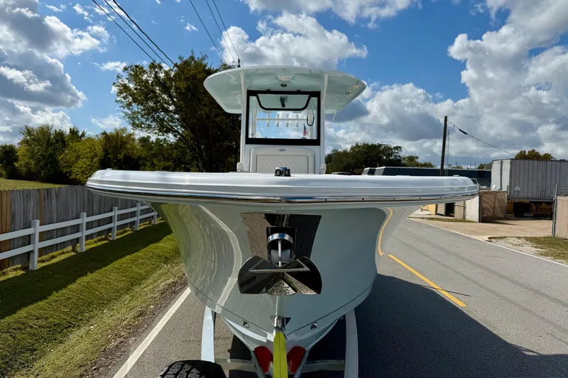 Slide: The Image of 2026 Sea Hunt Ultra 285 Coffin Box boat on trailer, sunny day, road view. - 6