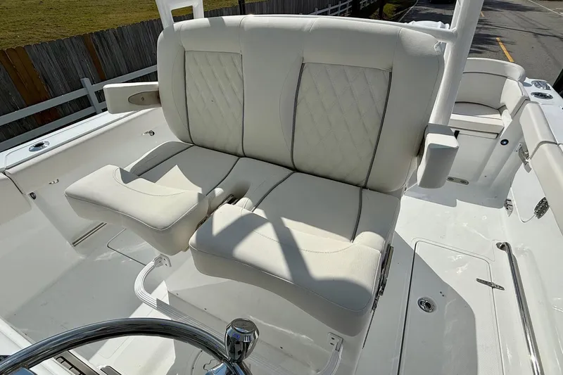 Slide: The Image of 2026 Sea Hunt Ultra 285 Coffin Box boat with luxurious seating and steering wheel. - 9