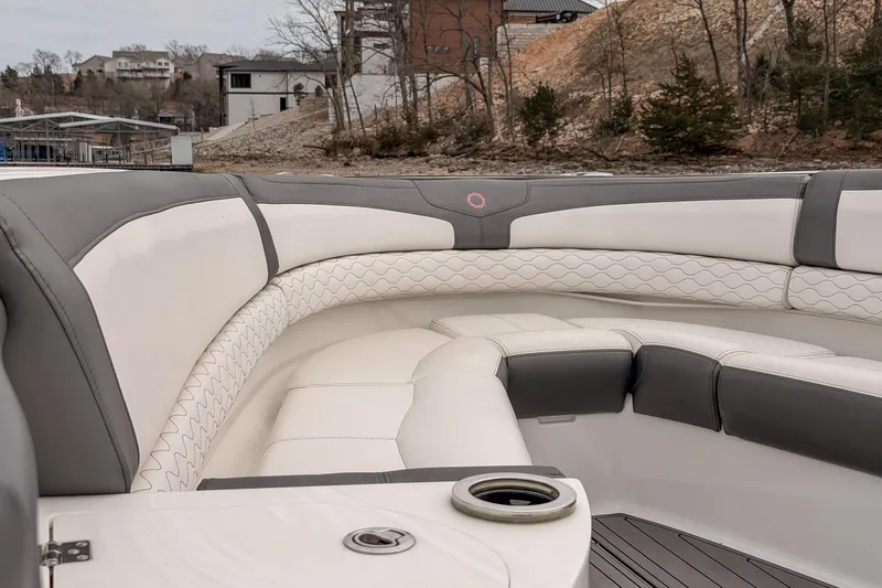 Slide: The Image of Luxurious seating on a 2020 Fountain 43 NX boat, featuring elegant white and gray upholstery. - 24