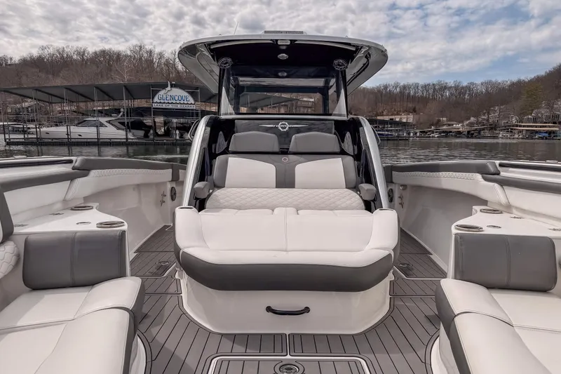 Slide: The Image of 2020 Fountain 43 NX boat interior with luxurious seating and scenic lake view. - 27