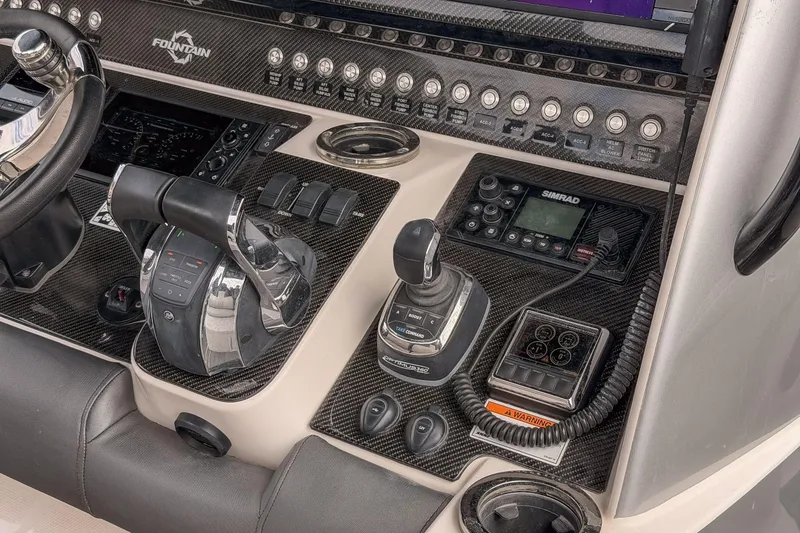 Slide: The Image of Control panel of a 2020 Fountain 43 NX boat with advanced navigation equipment. - 37