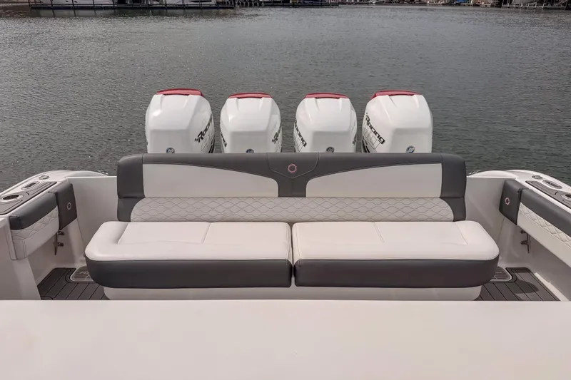 Slide: The Image of 2020 Fountain 43 NX boat with quad outboard engines and cushioned seating. - 44