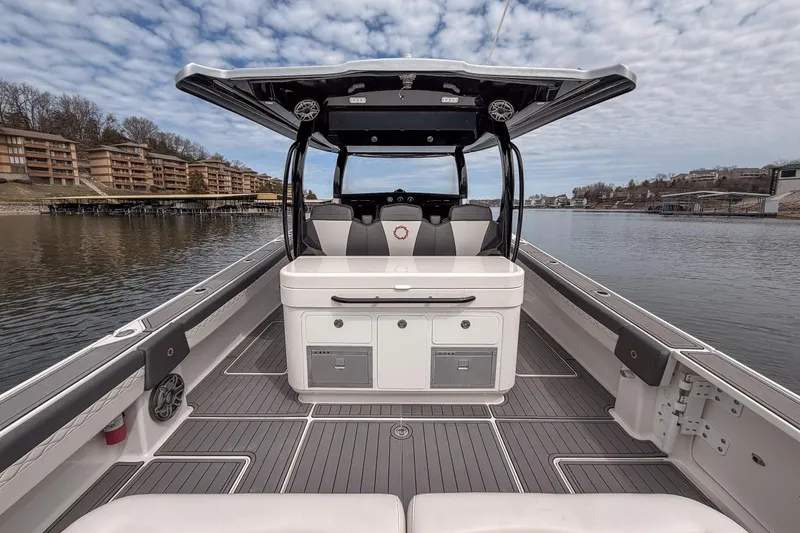 Slide: The Image of 2020 Fountain 43 NX boat interior with sleek design on a calm lake. - 50
