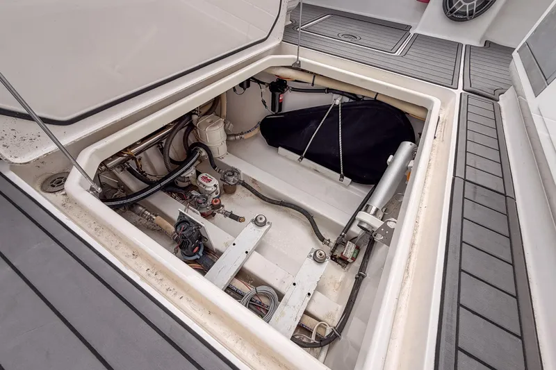 Slide: The Image of 2020 Fountain 43 NX boat storage compartment with mechanical components and wiring. - 53