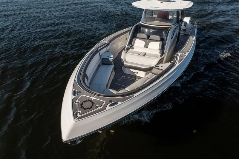 Slide: The Image of 2020 Fountain 43 NX boat cruising on open water, showcasing sleek design and luxury seating. - 6
