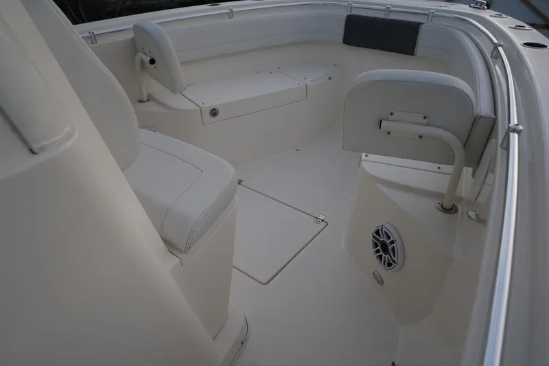 Slide: The Image of 2022 Cobia 266 boat interior with seating and speaker system. - 15