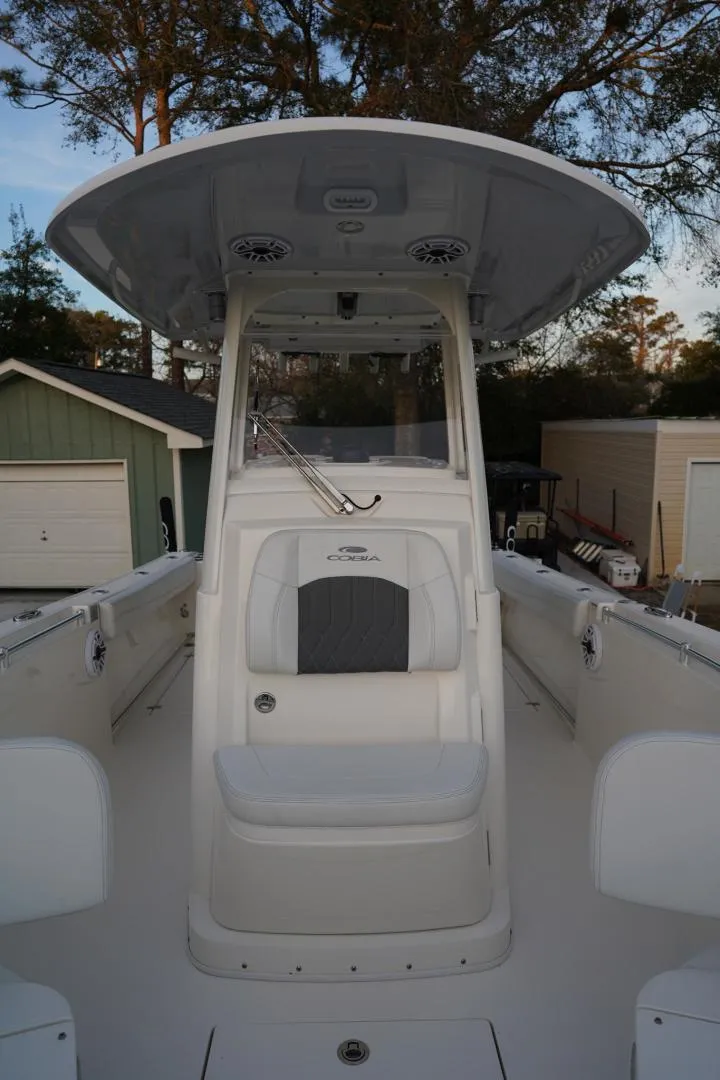Slide: The Image of 2022 Cobia 266 boat with spacious deck and modern design. - 21