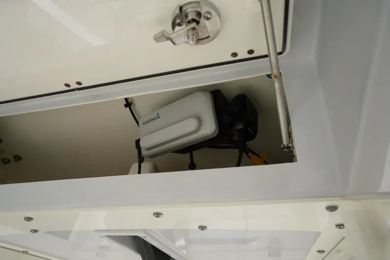 Slide: The Image of 2022 Cobia 266 boat compartment with Garmin equipment installed. - 32