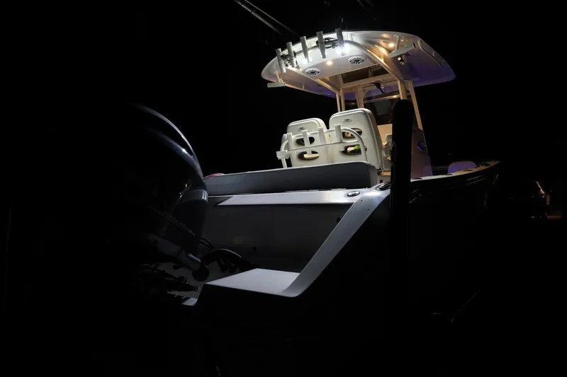 Slide: The Image of 2022 Cobia 266 boat illuminated at night, showcasing sleek design and modern features. - 45