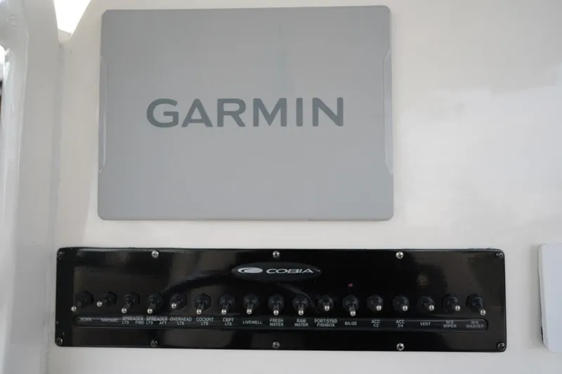 Slide: The Image of Garmin display and control panel on 2022 Cobia 266 boat. - 6